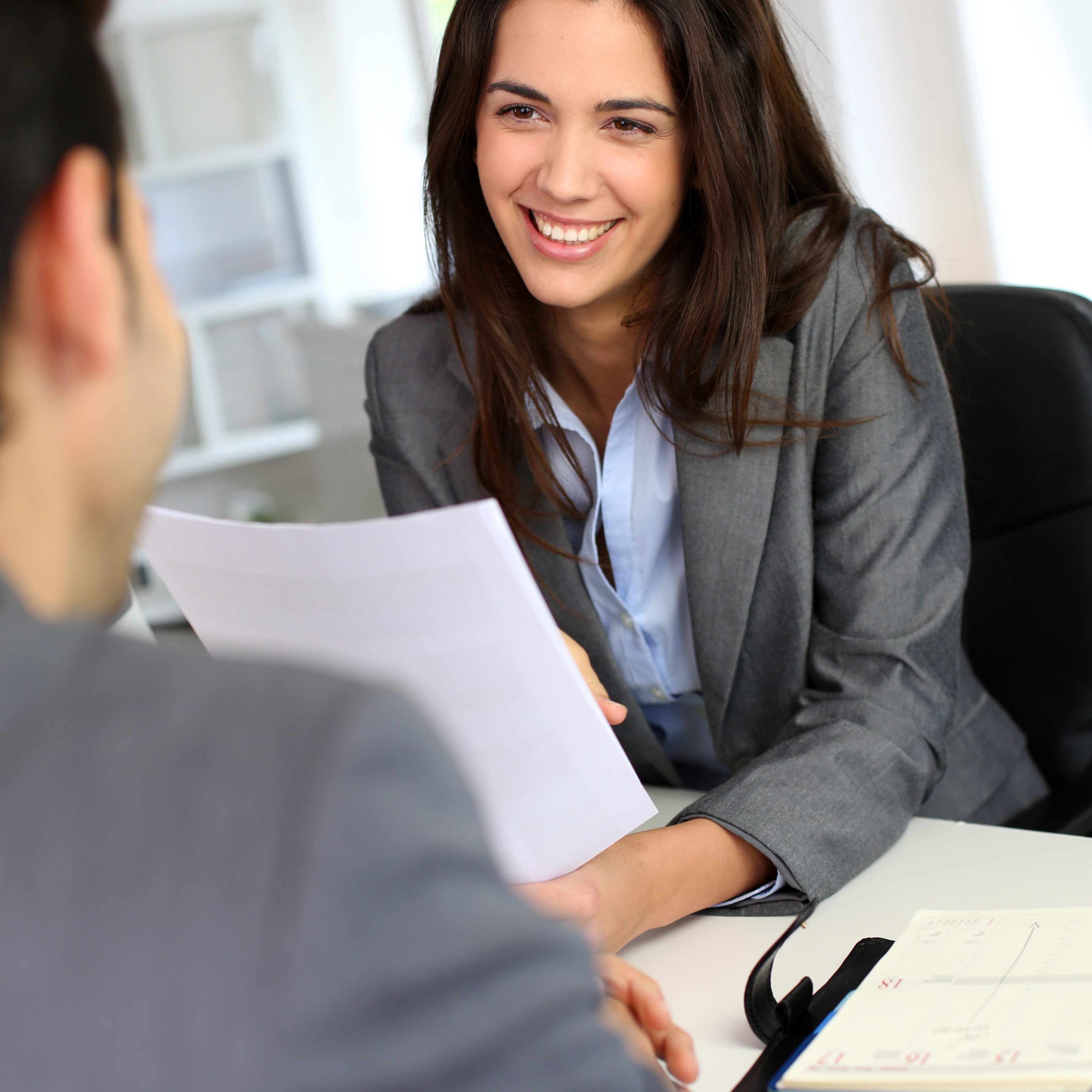 Businesswoman giving job interview